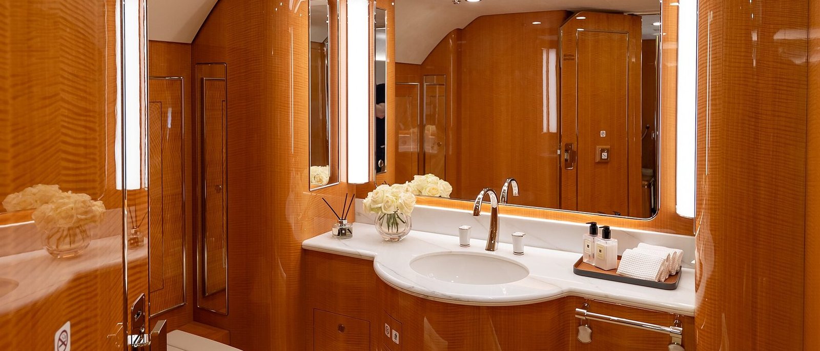 Polished vanity with a lit mirror